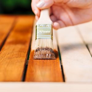 Varnish being brushed onto wood - Flow cup measurement